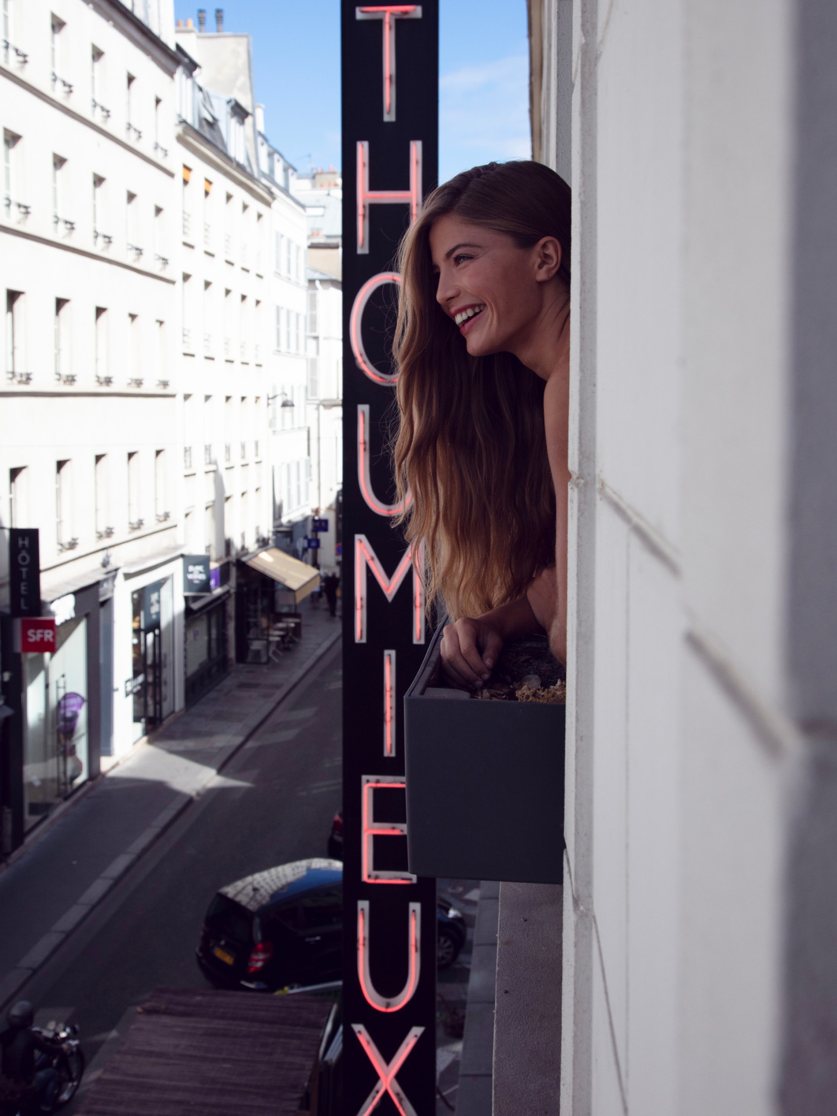 Entrance to the Hôtel Thoumieux Paris 7ème with illuminated sign, left bank hotel